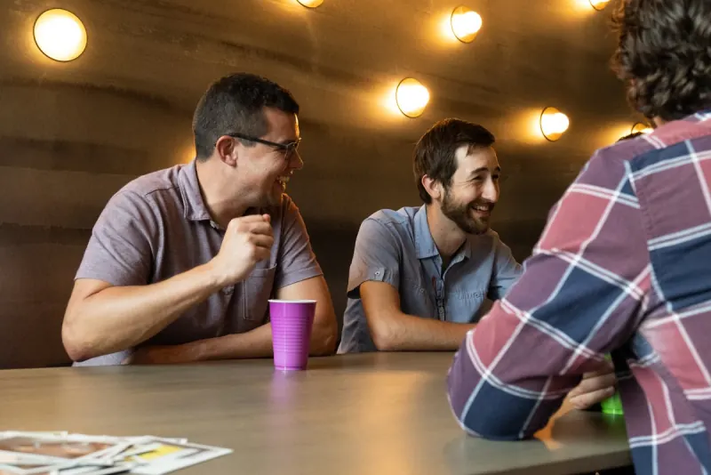 Men in conversation around a table
