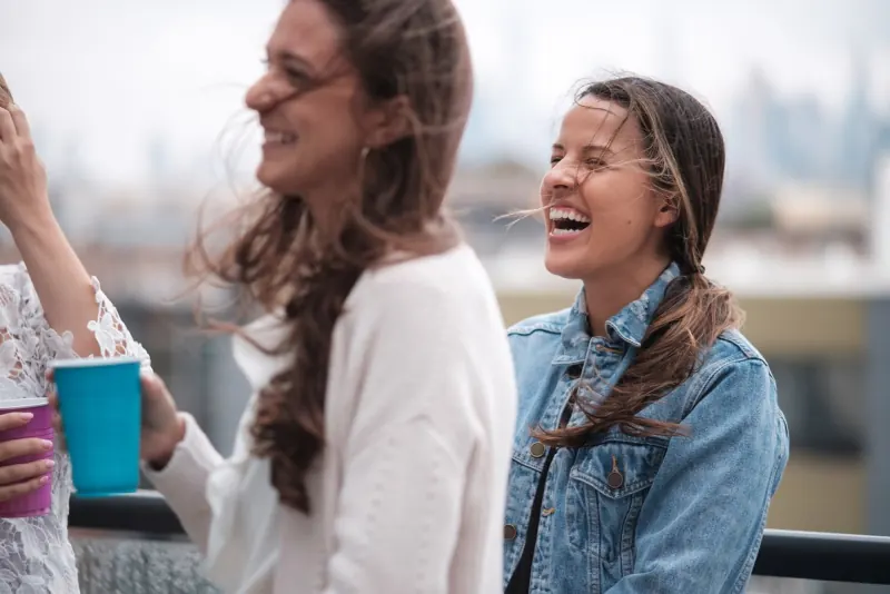 Two women laughing together