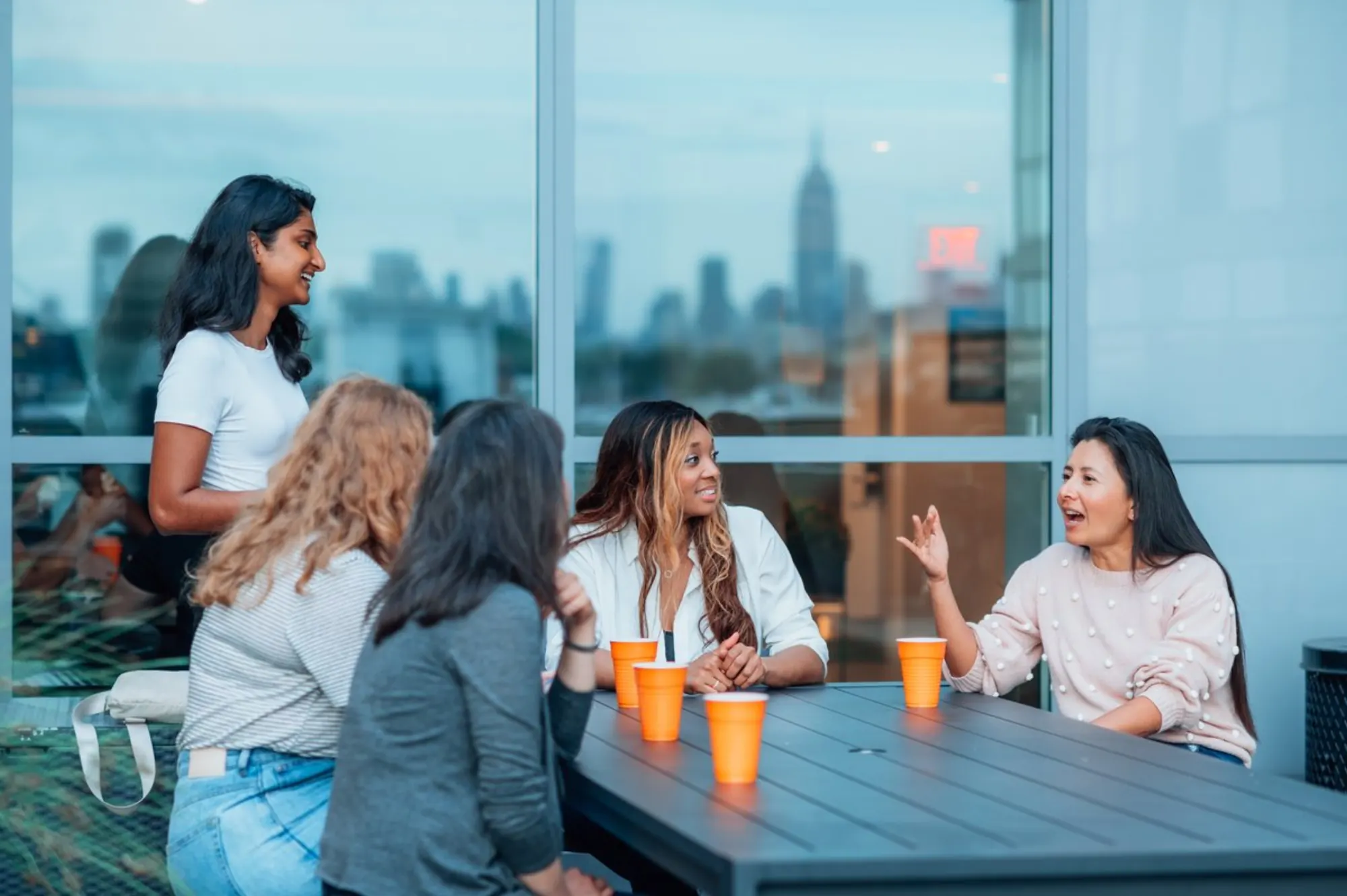 A Dinner Group talking around an outdoor table