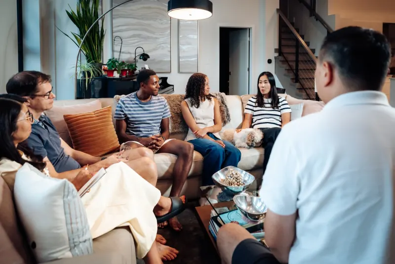 A Dinner Group talking in a living room