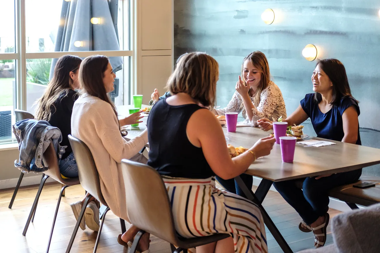 Women gathered around a table at a Dinner Group